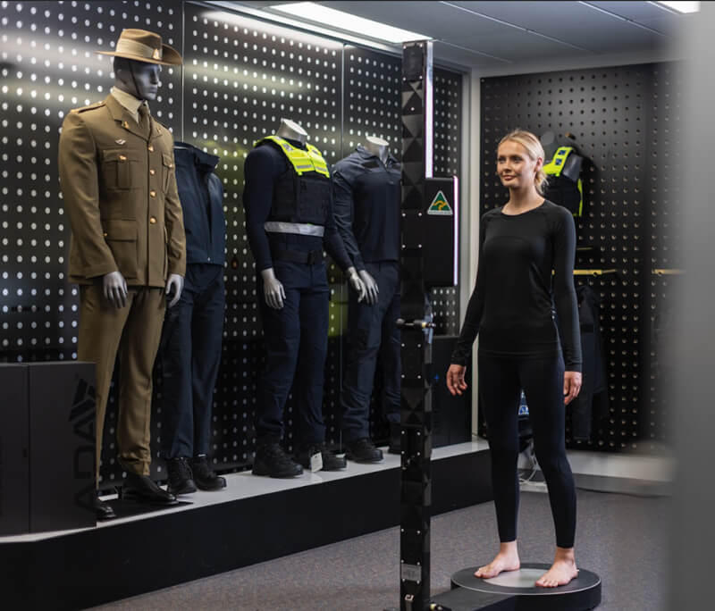 woman on scanner in uniform room